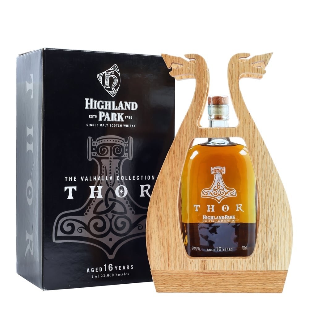 Casks Galore Whisky Scotland Casks Galore Whisky Scotland Thor by Highland Park whisky bottle in a carved wooden stand paired with the black Valhalla Collection box behind it 16 year age statement visible on the bottle and box casks galore casks galore